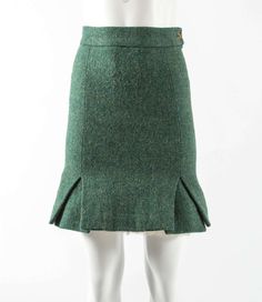 For Sale on 1stDibs - Vivienne Westwood Autumn-Winter 1991 green tweed mini skirt with white tulle crinoline at the front with broderie anglaise trim. Fitted Tweed Pencil Skirt, Winter Fitted Tweed Skirt, Fitted Green Tweed Dress For Fall, Green Tweed Dress For Workwear In Fall, Fitted Green Mini Skirt For Fall, Fitted Green Mini Skirt For Winter, Green Tweed, The Vivienne, Tweed Mini Skirt