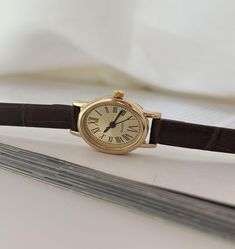 Gold Womens Wrist Watch, Vintage Gold Watch, Roman Numerals Minimal Watch, Small Retro Watch, Leather Strap Dainty Watch, Dainty Dial, Gift + Quartz Movement + Stainless Steel Case + Adjustable Leather Strap + Vintage Look + Oval Dainty Dial + Roman Numeric + Dainty Design + Minimal Look + Shipping From EU to World Wide Leather Gold Watch, Small Watch Women, Small Leather Watch, Vintage Watch For Women, Retro Watches Women, Small Watches Women Vintage, Gold Dainty Watch, Vintage Watches Women Leather, Small Watches Women