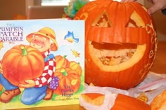 there is a pumpkin and a book on the table