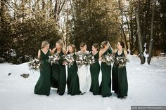 a group of women standing next to each other in the snow