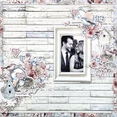 an old photo frame is decorated with flowers and hearts on the wood paneled wall