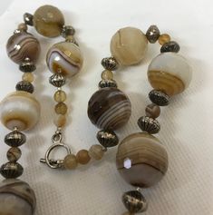 I am not sure of the origin of this agate, I think maybe Brazil or Australia. gorgeous stuff. never saw banding like this, or honeycomb face ting. Amber Beaded Agate Necklace, Artisan Amber Agate Beaded Necklaces, Large Amber Agate Beads, Amber Polished Agate Beads, Brown Large Agate Beads, Beautiful Beaded Necklaces, Ruby Pendant, Banded Agate, Key Pendant