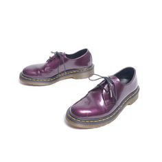 Great pair of vintage purple metallic Doc Martens. Excellent vintage condition with a few scuffs. UK size 4, or a US size 5.  If you would like to see additional photos or have any other questions, please do not hesitate to ask, and thanks for looking! Shipping disclaimer: All domestic orders under 16oz ship USPS Ground Advantage. All domestic orders over 16oz ship USPS priority mail. All international orders under 4lbs ship via Etsy's Global Shipping Program. All international orders over 4lbs ship USPS priority mail. If international buyers wish to have a package that is under 4lbs shipped via priority mail, please contact me before purchasing so that I can adjust the shipping charges. Insurance can be added to any domestic or international order, please contact me before purchasing so t 2000s Doc Martens, Vintage Purple Bag For Everyday Use, Lilac Doc Martens, Oxblood Doc Martens, Doc Martens Purple Laces, Doc Martens, Tie Shoes, Womens Oxfords, Dr. Martens