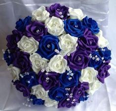 a bridal bouquet with blue and white flowers