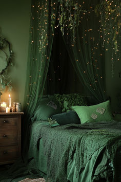 a bedroom with green bedding and lights on the ceiling, along with greenery