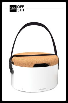 a white and black basket with cork inside on the back of an advertise