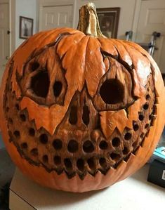 a carved pumpkin sitting on top of a table