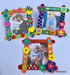 three colorful frames with buttons and flowers on them, one is holding a small child