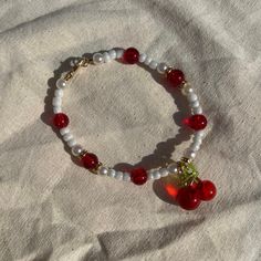 Handmade in the UK🇬🇧 Just over 18cm - please message for custom sizing (prices may vary slightly). Handmade using beading wire for durability. - not suitable for young children due to choking hazard - please refrain from getting the jewellery in contact with water Instagram - @wearecoastalcharms🐚✨ Thank you for supporting my small business Red Clay Bracelet Ideas, Cute Red Beaded Bracelet With Heart Beads, Red Adjustable Fun Beaded Bracelets, How To Make Cherry Bead Bracelet, Red Bracelet Ideas, 80s Bracelets, Cherry Beaded Bracelet, Small Bead Bracelets Ideas, Red Beaded Heart-shaped Bracelet