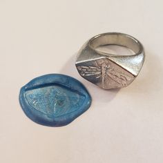 This signet ring is cast in lead-free pewter. The ring size when cast is 7.25. The sealing image is a dragonfly.       This is part of a series of signet rings I am making cast from lead-free pewter. Each master ring is hand sculpted to give a unique, rustic style, multi-dimensional relief image when used as a stamp to seal, with sealing wax. Ring Styling, Wax Seal Ring, Stamp Ring, Fly Insect, Pewter Ring, Mouse Character, Dragonfly Ring, Dream Rings, Seal Ring