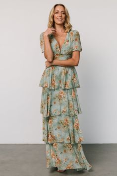 Our Montaigne Maxi Dress comes in blue sage color with beautiful floral and is oh so gorgeous. Don't forget to get this dress for your next event! Flowy Ruffled V-neck Chiffon Dress, Fitted Chiffon Tiered Dress, Flowy Floral Print V-neck Dress, Flowy Chiffon Maxi Dress With V-neck, Flowy V-neck Chiffon Maxi Dress, Flowy Chiffon V-neck Maxi Dress, Chiffon V-neck Maxi Dress For Brunch, Fitted Chiffon V-neck Maxi Dress, Fitted Tiered Chiffon Dress