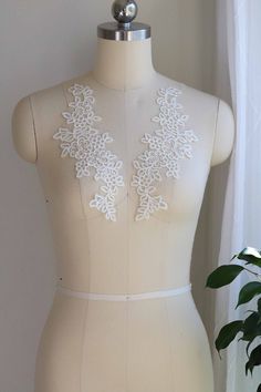 Ivory Lace Applique, Wedding Dress Lace Applique, Bridal Lace Applique, Lace Applique, Bridal Veil Lace Applique, Corded Lace Applique Price is for 1 pair Color: Ivory Features: Made by Rayon Corded Lace Applique Mirrored Pair Unique leaves 🍃 pattern Great for making bridal gowns, bridal veils, garters, dancing costumes and other fashion designs. Shipping method: The default shipping method is by USPS first class, especially for the FREE SHIPPING items. Please choose priority or express mail if White Scalloped Lace Sleeveless, Sleeveless White Scalloped Lace, White Fitted Wedding Dress With Delicate Lace, White Sleeveless Wedding Dress For Ceremony, White Lace Back Wedding Gown, White Lace Back Wedding Dress, White Wedding Gown With Lace Back, White Wedding Dress With Lace Back, White Sleeveless Gown With Lace Trim