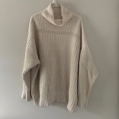 New Never Worn Soft 100% Polyester Chunky Knit Beige Chunky Sweater, Chunky Knit Cream Sweater, Chunky Knit Turtleneck Sweater For Loungewear, Cozy Oversized Ribbed Sweater, Oversized Cozy Ribbed Sweater, Oversized Ribbed Cozy Sweater, Neutral Knitted Winter Tops, Knitted Neutral Tops For Winter, Chunky Knit Sweater For Loungewear