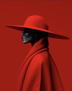 a mannequin wearing a red coat and hat with a black face in front of a red background