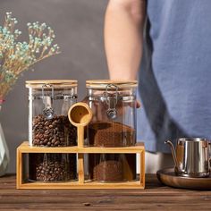 Forget about leaving coffee grounds or beans in the bagThese coffee containers will keep them fresher for longer. Coffee Bar Containers, Coffee Container Ideas Storage, Coffee Container Ideas, Coffee Bean Storage, Coffee Storage Containers, Coffee Bean Jar, Oatmeal Container, Coffee Organization, Bamboo Spoon