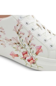 Dreamy watercolor flowers bloom across the midsole and sidewall of this romantic low-top platform sneaker cushioned by dual-density foam for all-day comfort. Cushioned footbed with arch support Pillow Walk™ comfort technology Synthetic upper/recycled-polyester textile lining/rubber and leather sole Imported Casual Low-top Floral Print Sneakers, White High-top Sneakers With Floral Print, Sporty Floral Print Sneakers With Round Toe, Pink Lace-up Sneakers With Floral Print, Spring Floral Print Sneakers With Round Toe, Floral Print Round Toe Sneakers For Spring, Spring Floral Print Round Toe Sneakers, Pink Floral Print Lace-up Sneakers, High-top Floral Print Sneakers For Spring