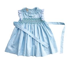 This lovely dress is made from cotton with beautiful blue sky color fabric and lace. It has intricate hand smocking with embroidered little flowers. Comfortable, perfect for everyday wear as well as formal occasion. *  100% cotton *  100% Handmade *  Tie at the back *  Lightweight, comfortable, and ready to play *  Hand wash or machine wash on a delicate setting We are based in Sydney, New South Wales, Australia. We always ship the dress out within 1 business day.  Within Australia, Standard shi Spring Cotton Smocked Dress With Ruffles, Blue Lace Trim Dress For Garden Party, Summer Cotton Smocked Dress With Lace Trim, Summer Smocked Dress With Lace Trim For Daywear, Summer Daywear Smocked Dress With Lace Trim, Elegant Smocked Dress With Lace Trim For Spring, Elegant Cotton Dress With Smocked Bodice, Fitted Cotton Broderie Anglaise Dress, Elegant Light Blue Cotton Dress