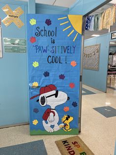 a door with a sign that says school is paw - sitively cool