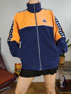 DESCRIPTION Vintage Kappa track jacket in velour fabric in navy blue and orange.  CONDITION This vintage jacket is in great vintage condition SIZING This vintage jacket is labelled as size men M and estimated as size M-L > Please check measurements below as all vintage sizes are different Measurements: Arms from sleeve till neck seam: 79cm Armpit to armpit: 56cm Back: 72cm Model is size XS/S and is 1m65 MATERIAL 100% polyester WITH LOVE  All vintage fashion for women are washed and shipped from Alix Earle, Sport Jacket, Velour Fabric, Vintage Clothing Online, Summer Sports, Mode Vintage, Sports Jacket, Vintage Pieces, Track Jacket