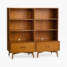 an open bookcase with two drawers on each side