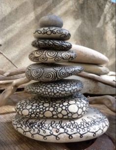 a stack of rocks sitting on top of a wooden table