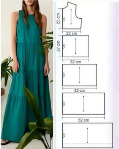 a woman in a long dress is standing next to a potted plant and measurements