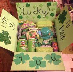 an open st patrick's day box filled with candy and other items for sale