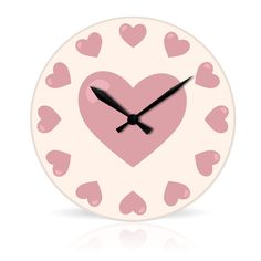 a white clock with pink hearts on it