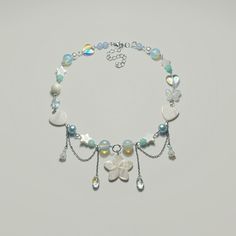 a bracelet with charms and beads on it