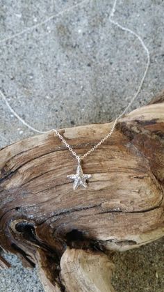 "Tiny sterling silver starfish pendant. The sterling silver charm is a dainty 9mm with a shiny finish. It has a delicate sterling silver chain and clasp. Shown here in 17\" length. *If you are unsure of the length you need, or would like to wear this item at different lengths, we now offer an adjustable length option! You can add an adjustable end to your necklace using this link: https://www.etsy.com/listing/791277751/necklace-extension-added-to-your All items are gift wrapped and shipped witho Sterling Silver Starfish Necklace As Gift, Ocean-inspired Silver Necklace With Star Charm, Sterling Silver Ocean-inspired Jewelry With Star Charm, Sterling Silver Starfish Charm Pendant Necklace, Sterling Silver Starfish Charm Necklace, Ocean-inspired Sterling Silver Star Charm Jewelry, Sterling Silver Pendant Necklace With Starfish Charm, Sterling Silver Necklace With Starfish Charm, Sterling Silver Starfish Necklace With Star Charm