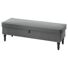 a gray bench sitting on top of a white floor