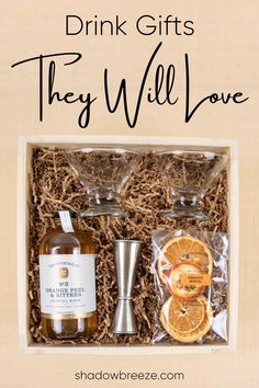 the gift box contains two glasses, an orange slice and a bottle of alcohol with text that reads drink gifts they will love