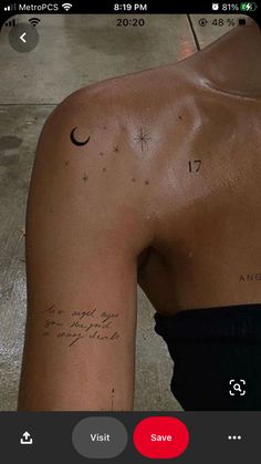 the back of a woman's arm with tattoos on it and an arrow in the middle