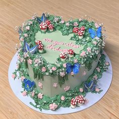 there is a cake decorated with flowers and butterflies