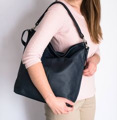 The leather handbag is made of 100% high quality natural Italian leather. Leather hobo bag in fashionable and classical style. The interior of the bag has lining. The shopper purse is very roomy. Fits easily A4 format (US Lettel format) Large pocket inside of the bag divides the compartment into two parts Closed with a zipper / slider It has as a long attachable and adjustable strap allowing you to wear is on the shoulder or crossbody. Inside there are two pockets: one zipped, one for a phone an Everyday Tote Bag, Purse Organizer, Designer Purses, Bags Leather Handbags, Brown Leather Handbags, Bag Dark, Hobo Bags, Handbag Leather, Brown Leather Bag