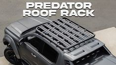 a gray truck with the words predator roof rack on it