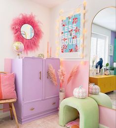 a room filled with furniture and decor in pastel colors, including pink, green, yellow, and blue