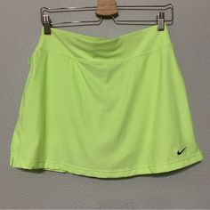 Vintage Nike Neon Green Tennis Skirt Size Medium. Boy Short Skort Underneath. Navy Blue Embroidered Swoosh At The Hem. New With Tags. Nike Skirted Bottoms For Summer, Nike Lined Skort For Spring, Nike Casual Skort For Summer, Nike Casual Summer Skort, Nike Lined Skirt For Spring, Casual Nike Skort For Summer, Green Sports Skirt For Spring, Green Mini Skirt For Sports, Nike Fitted Summer Skort