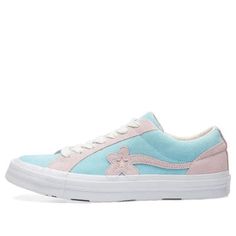 The Golf Le Fleur x Converse One Star Ox 'Plume' is the latest release from Tyler, the Creator and Converse. This sneaker features a suede upper in Plume with Pink Marshmallow overlays. The flower pattern One Star on the side panel is a signature detail, while white contrast stitching and white leather lining complete the look. The vulcanized rubber midsole is white, and the flower motif continues on the footbed and outsole. Tyler, the Creator's unique style comes through in every detail of this shoe, and it's sure to turn heads wherever you go! (SNKR) Converse Suede Skate Shoes For Streetwear, Casual Converse Suede Skate Shoes, Converse Low-top Suede Sneakers, Sporty Suede Converse Sneakers, Converse Suede Sneakers, Converse Pink Leather Sneakers, Golf Le Fleur Converse, Converse Golf Le Fleur, Pink Marshmallow