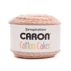 yarn that is pink and white with the words carbon cotton cakes on it in front of a