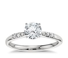 a white gold engagement ring with diamonds on it