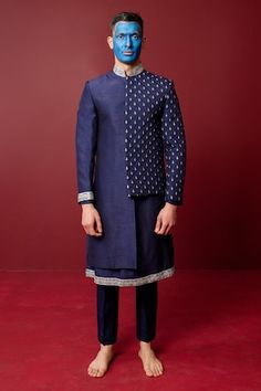 Navy blue asymmetric sherwani highlighted with quilted resham embroidery and floral patterns. Comes with inner kurta and pant. - Aza Fashions Designer Blue Kurta For Transitional Seasons, Designer Blue Nehru Jacket With Traditional Drape, Designer Blue Traditional Wear For Reception, Designer Blue Traditional Wear For Festive Season, Designer Blue Bandhgala With Traditional Drape, Blue Bandhgala For Navratri Designer Wear, Designer Blue Kurta For Festive Occasions, Designer Blue Nehru Jacket For Diwali, Blue Straight Kurta Bandhgala For Navratri