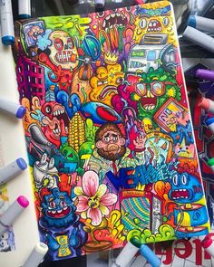 a drawing book with lots of colorful drawings on it