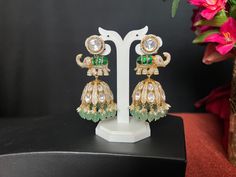 Jadau Kundan AD Moissanite Elephant Jhumka Earrings/ 3 Inches Long/wide 1.3 Inch/Kundan Green Stone/Mint  Green Beads Pearl Drop/Gold Finish These fabulous Earrings are high-quality and will match with a number of outfits. Wear them for any occasion, or give them as a gift.  DETAILS: Includes Two Earrings only. Length: 3.0 Inches Long  wide ; 1 i.3 Inch Wide  Weight for Earring Set: 2.10 oz ( 60 g) Earring backs Push to on/off.  Material: Imitation gold Finish/ Pachi Kundan green, AD Moissanite Festive Cutdana Jhumkas For Reception, Festive Cutdana Jhumkas, Green Chandbalis For Diwali Reception, Green Chandbalis For Reception And Diwali, Kundan Jhumkas With Latkans For Reception, Green Kundan Chandbalis For Reception, Green Chandbalis For Reception And Festivals, Temple Style Cutdana Jhumkas For Reception, Temple Jewelry Jhumkas For Diwali Reception