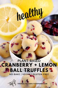 a bowl filled with cranberry lemon ball truffles next to sliced lemons