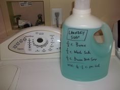 a hand sanitizer sitting on top of a counter next to a dryer