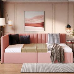 a living room with a pink couch and white rug