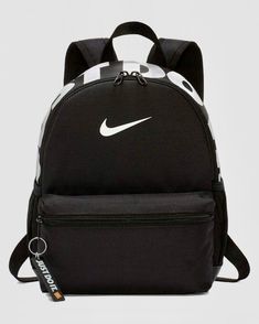 YOU ARE BUYING: NIKE BRASILIA JDI KIDS MINI BACKPACK BLACK/WHITE STYLE# BA5559-013 ITEM DESCRIPTION: - BRAND: NIKE  - 100% AUTHENTIC - MATERIAL: 100% POLYESTER - ONE SIZE - HAUL LOOP - ZIP CLOSURE - PADDED BACK PANEL - ADJUSTBLE SHOULDER STRAP - MESH POCKETS ON BOTH SIDE - PADDED MESH PANEL SHOULDER STRAP - CAPACITY: 671 CUBIC INCHES - MEASUREMENT: HEIGHT: 13" WIDTH: 10" DIAMETER: 5"  (IN INCHES)     (THESE SIZES ARE APPROXIMATE MEASUREMENTS AND INTENDED FOR REFERENCE ONLY.) - IMPORTED NOTE: PLE Mochila Nike, Cute Mini Backpacks, Nike Backpack, Nike Bags, Mini Mochila, Training Bags, Unisex Backpack, Backpack Sport, Nike Kids