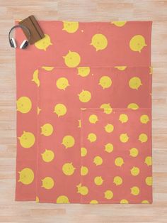 a pair of scissors sitting on top of a piece of paper with yellow polka dots