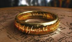 the lord's ring sits on top of an old map